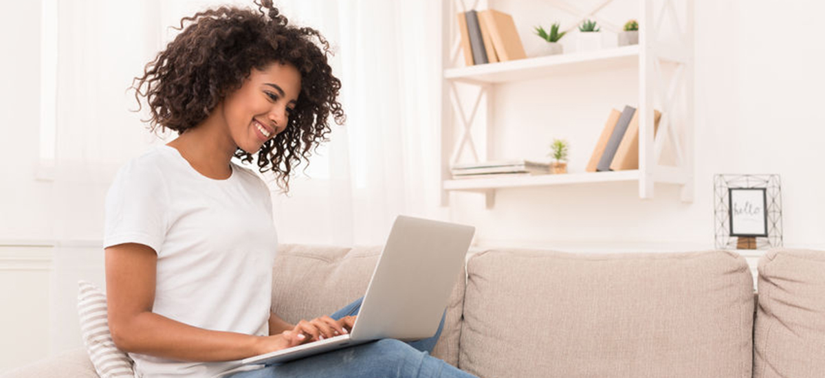 Slide Image of happy young woman using a laptop computer