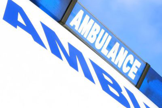 Image. Cropped phot of ambulance sign on top of ambukance.