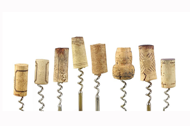 Image - eight corkscrews in a line with corks of various types and sizes
