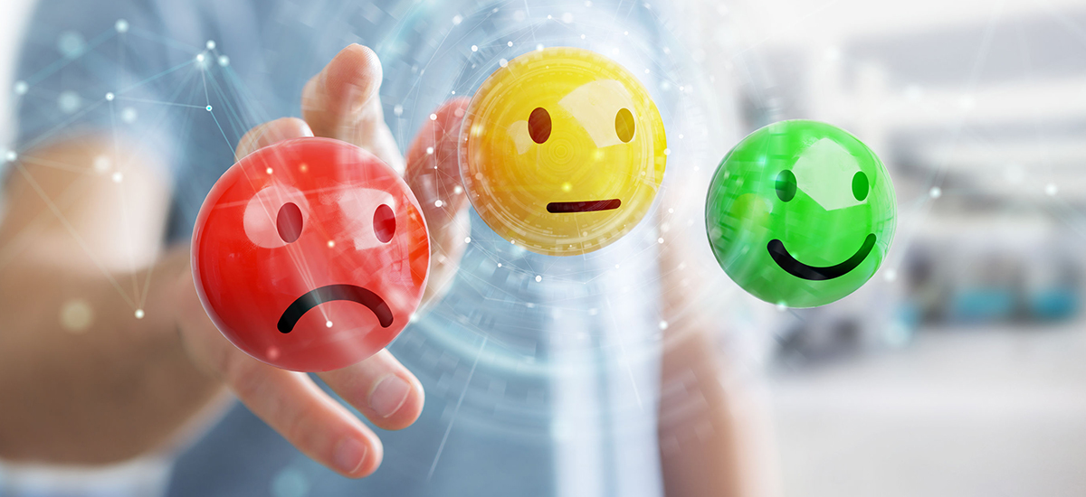 Slide Image. Vector image showing three balls in red yellow and green depicting dissatisfaction, neutrality or delight respectively