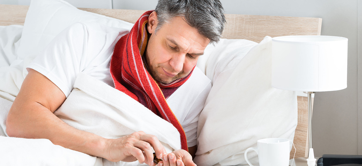 Slide Image of man in bed using a smart phone