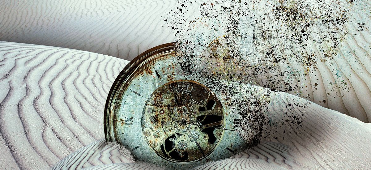 Slide Image. Vector image of a clock face disintigrating into sand on a desert backgrount